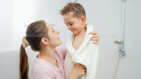 Caring Mother Drying Her Son With Towel And Hugging After Bathing